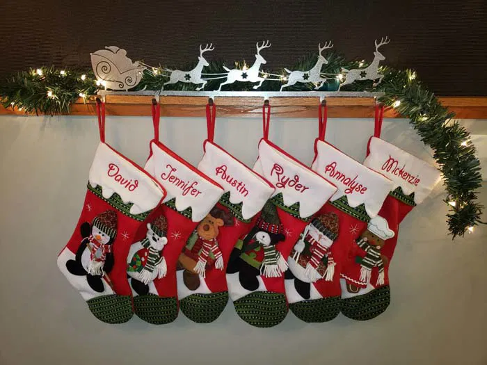 Rustic wooden centerpiece with metal scrollwork and potted plants.