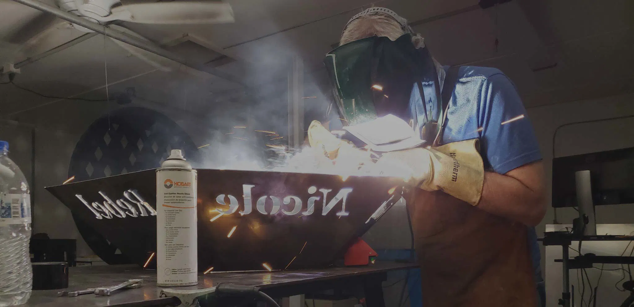 Rustic farmhouse kitchen with wooden cabinets, metal accents, and vintage decor.